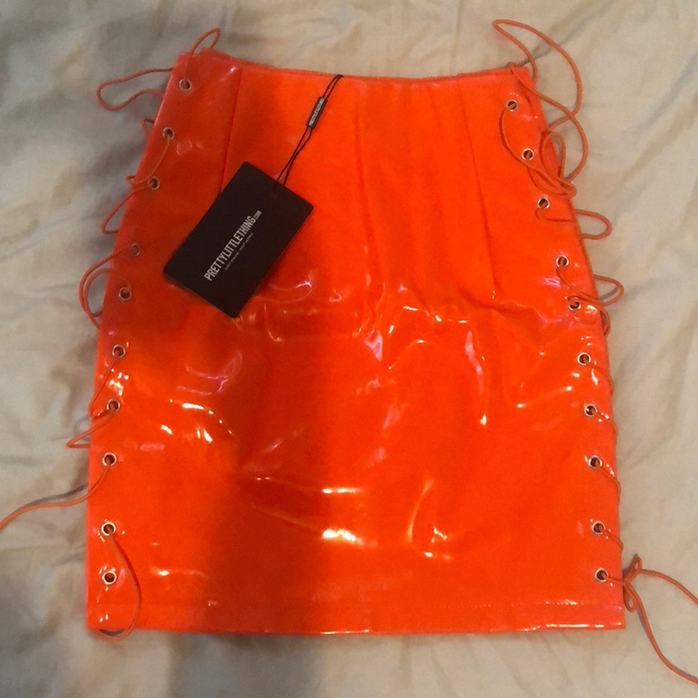 Neon orange vinyl lace up side mini skirt